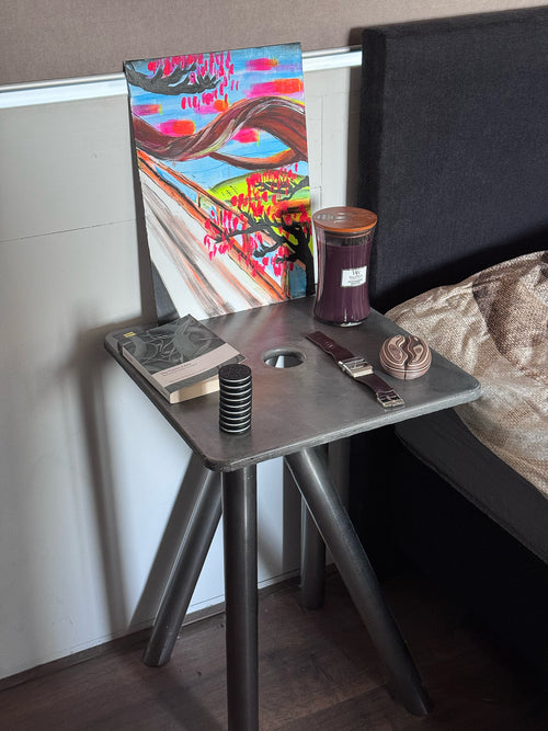concrete and stainless steel bedside table