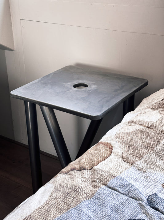 concrete and stainless steel bedside table